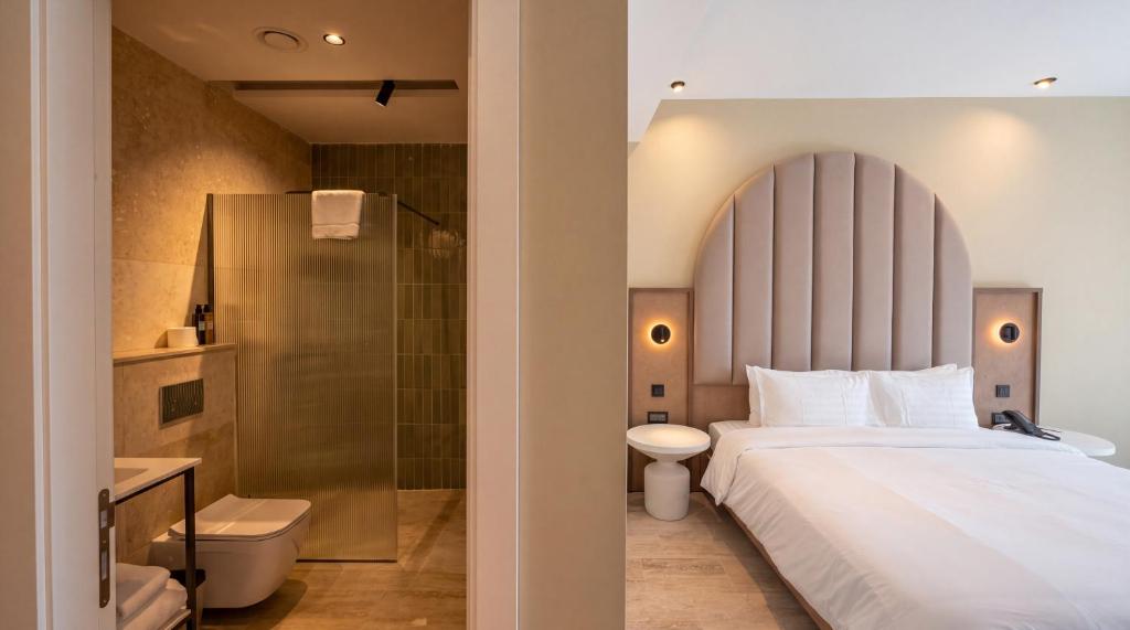 Double room with an upholstered headboard and an ensuite at St Anne Palace, Floriana, Malta