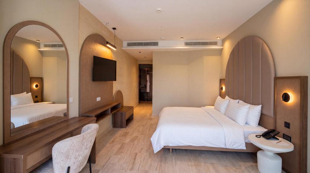 Double room with an arched headboard at St Anne Palace, Floriana, Malta