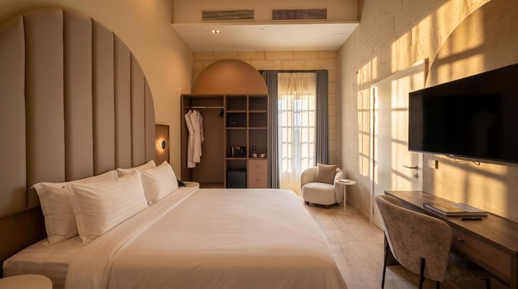 Double room with an arched alcove at St Anne Palace, Floriana, Malta
