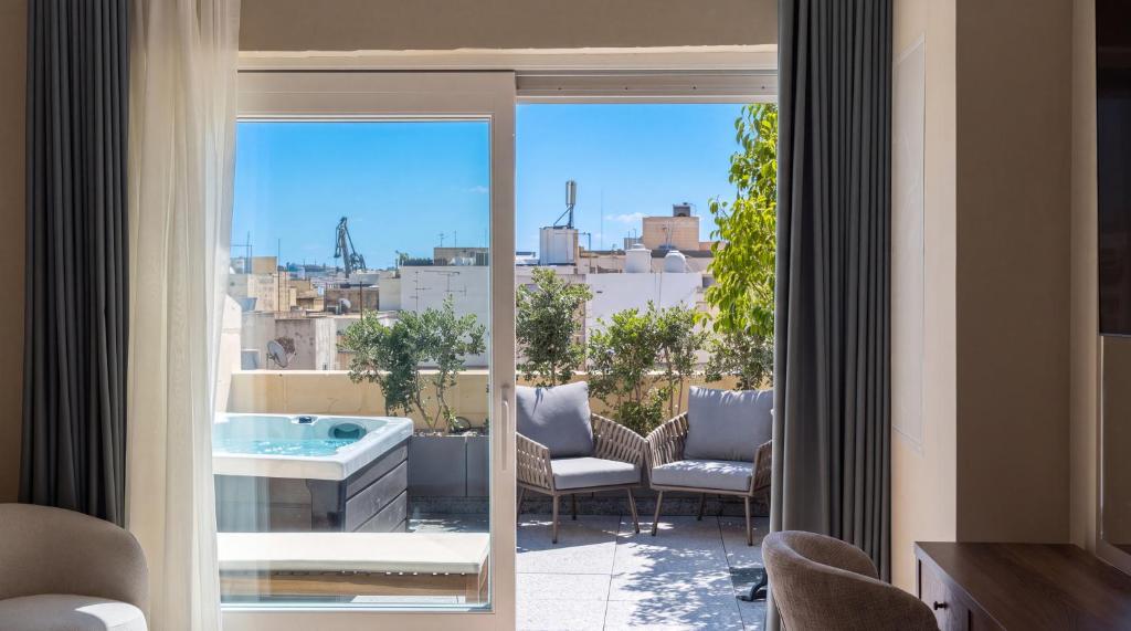 Rooftop pool with city views at St Anne Palace, Floriana, Malta